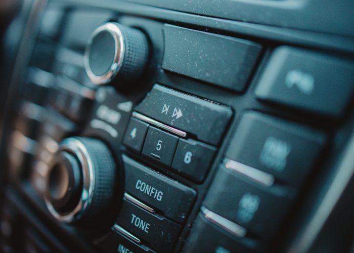 A closeup shot of a car's interior design with a detailed button panel